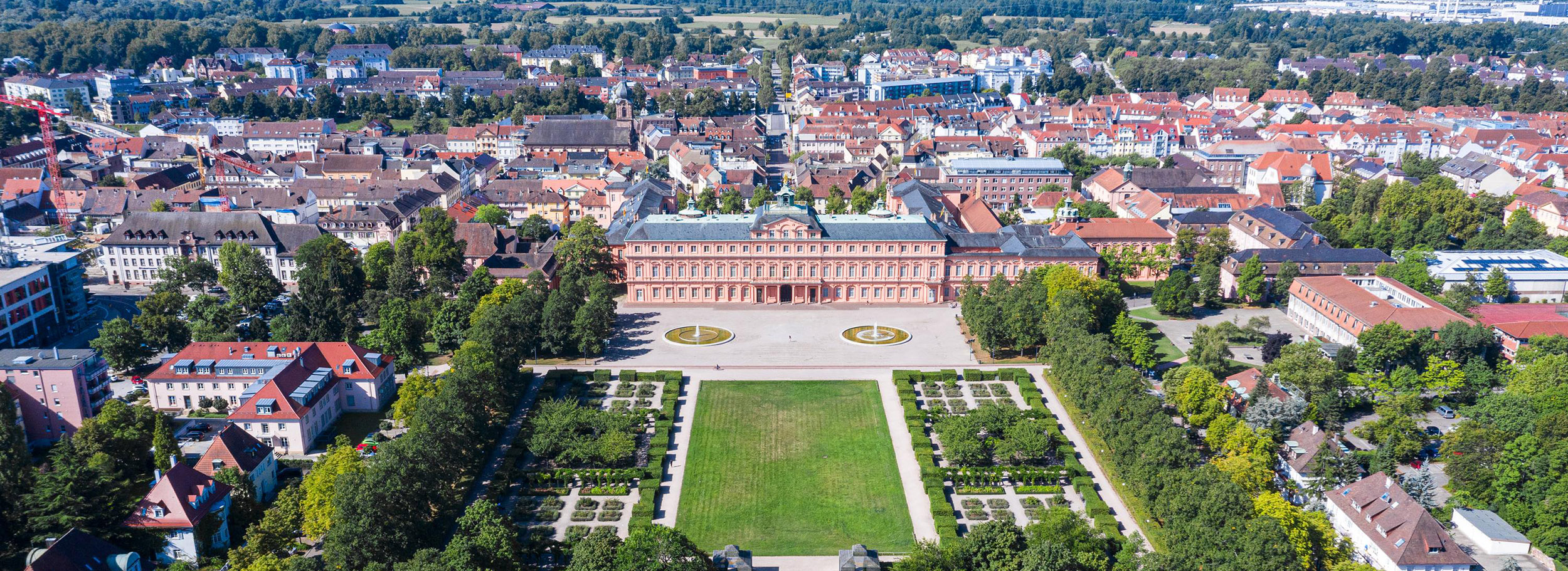 Aerial view of Rastatt Castle in the foreground and houses